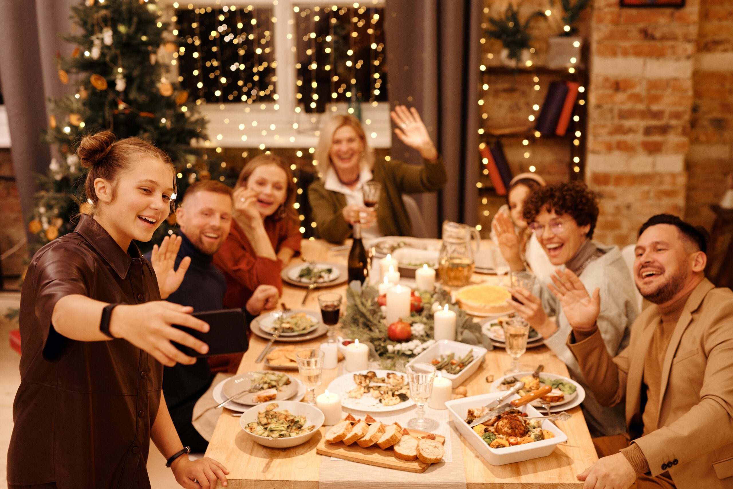 Illustration of Family Celebrating Christmas Dinner While Taking Selfie for the article titled Kickstart your New Year: Creating an Exclusive VIP Club Party at Home photographed by Nicole Michalou