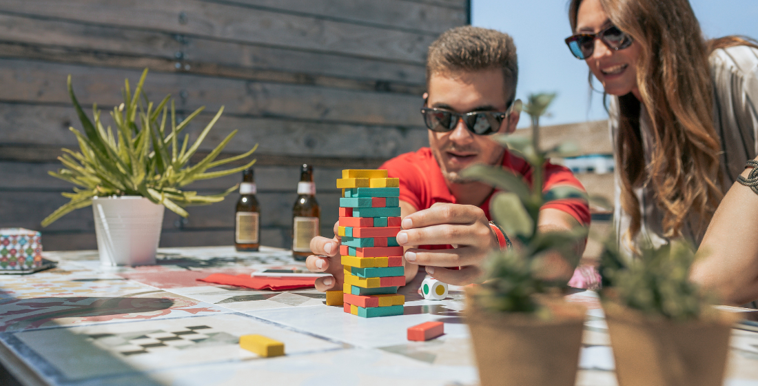 A boy and a girl playing Jenga