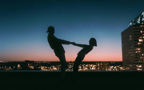 Featured image for the article "Planning Ahead: Preparing Your Love-filled Night of Cocktails and Dancing for Valentine’s Day 2024". showing Silhouette of Man Jumping on Field during Night Time