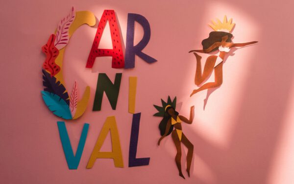 Featured image for the article "Crash Course in Carnival Celebrations: Tips and Tricks to Host a Fantastic Festivity for Rio Carnival 2024". showing Brown and White Woman Paper Cutout